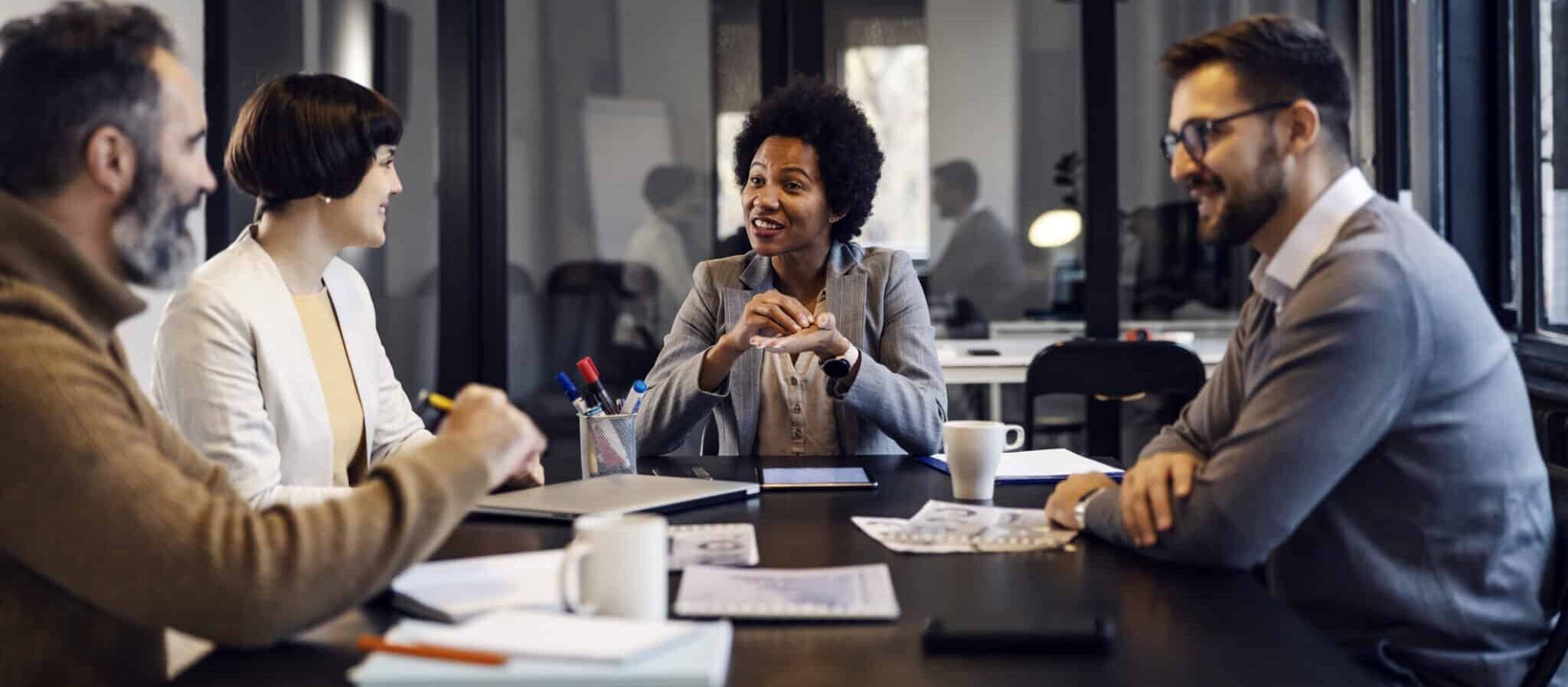 Group of multiracial businesspeople is having meeting in the office.