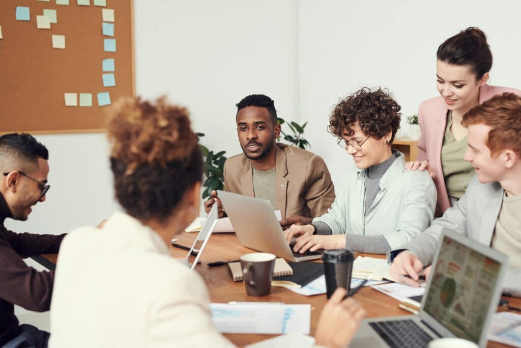 people in the office working together